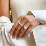 Round Brilliant Cut Engagement Ring with Tapered Baguettes