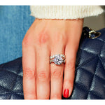 Round Brilliant Cut Engagement Ring with Tapered Baguettes