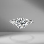 Round Brilliant Cut Engagement Ring with Pear Shape Side Stones