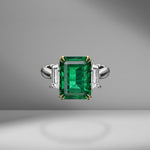 Emerald Ring Flanked with Trapezoid