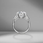 Round Brilliant Cut Engagement Ring with Tapered Baguettes
