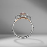 Pink Oval Cut Diamond Ring with Pear Shapes