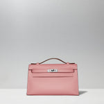 Kelly Pochette in Rose Confetti by Hermès
