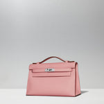 Kelly Pochette in Rose Confetti by Hermès